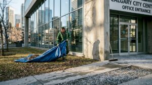 Worker cleaning office building exterior in spring