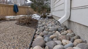 River rock and pea gravel beds in Calgary yard