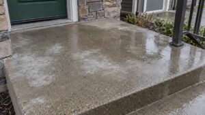 Cloudy sealer patches on damp concrete